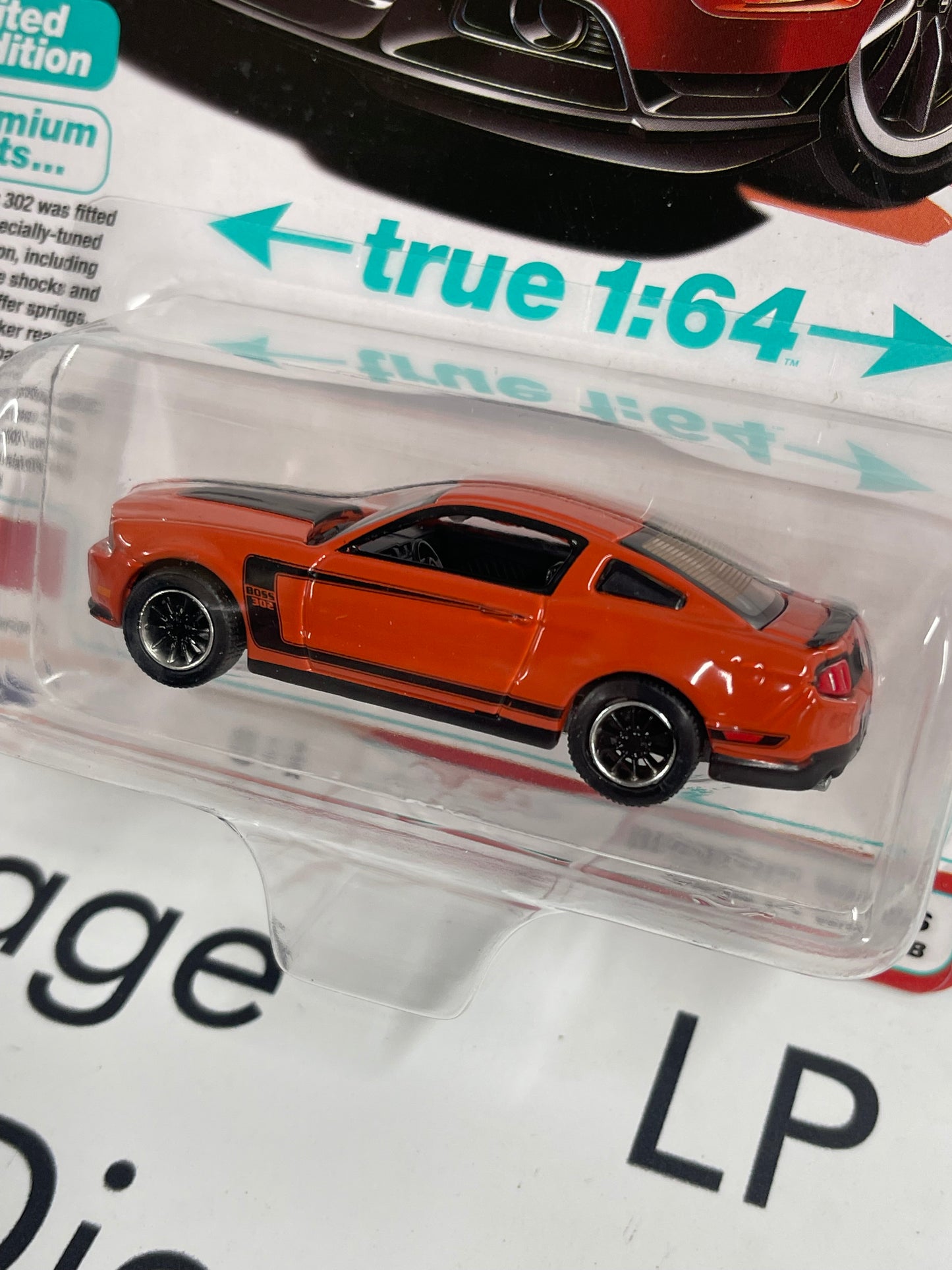 AUTO WORLD 2012 Ford Mustang Boss 302 Orange 1:64 Diecast Modern Muscle