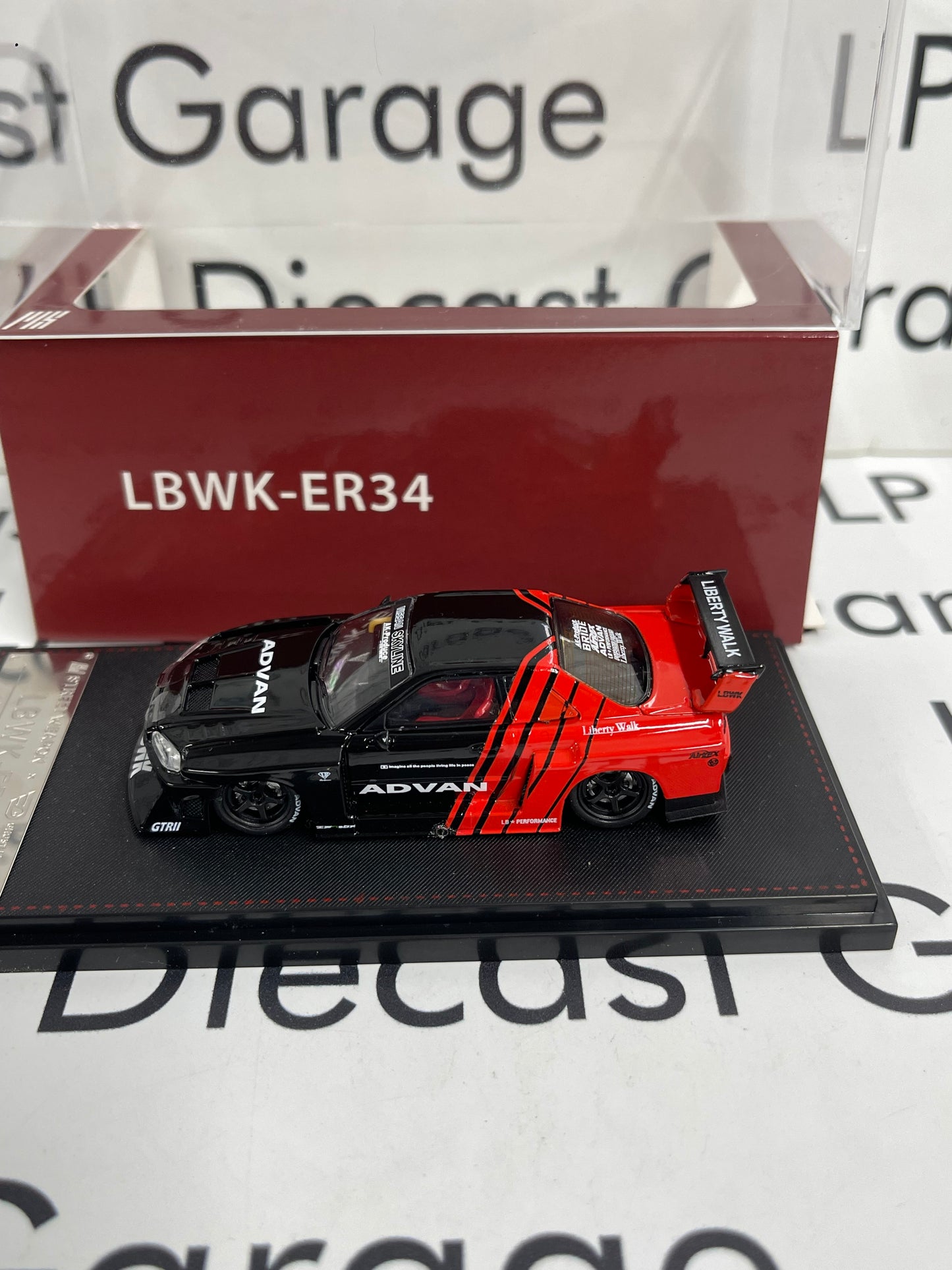 STREET WEAPON Nissan Skyline LBWK-ER34 Advan 1:64 Diecast Ghost Player