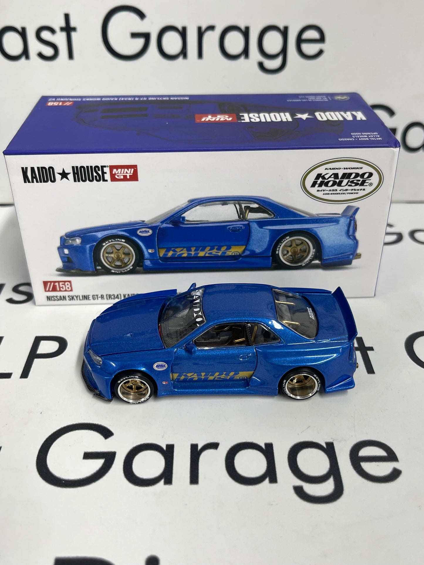 MINI GT KAIDO HOUSE Nissan Skyline GT-R R34 V2 Blue 1:64 Diecast