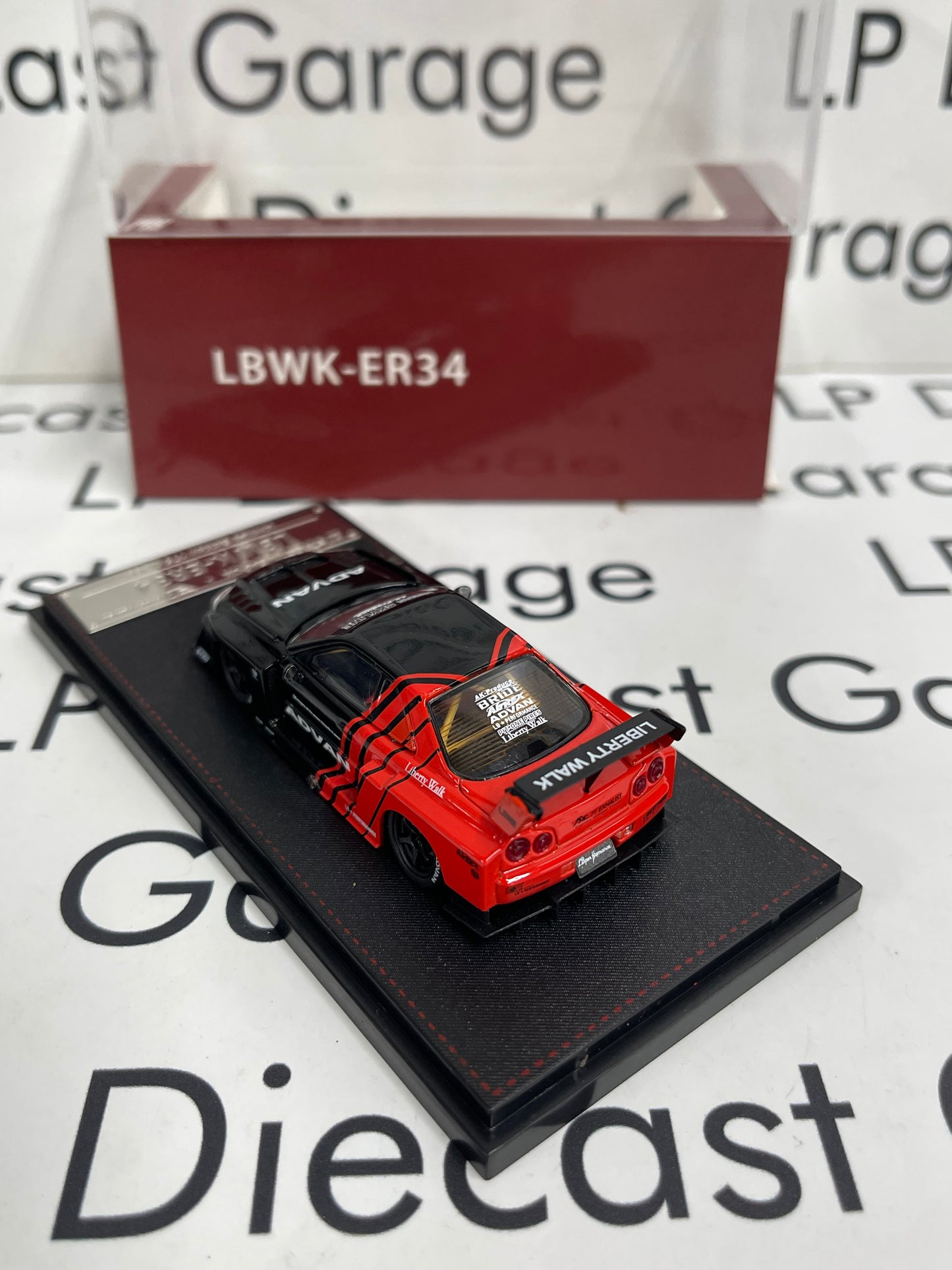 STREET WEAPON Nissan Skyline LBWK-ER34 Advan 1:64 Diecast Ghost Player
