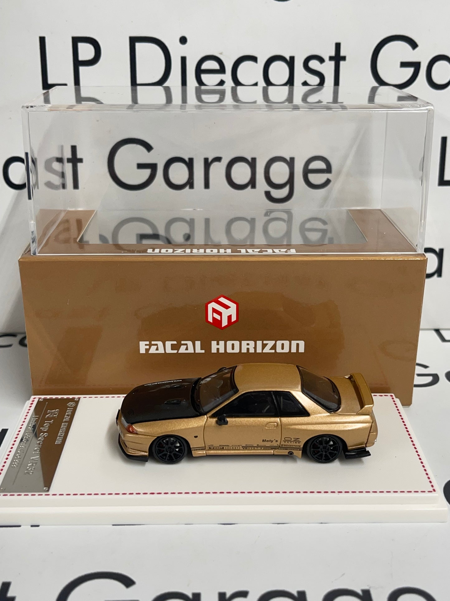 FACAL HORIZON Nissan Skyline GT-R Top Secret VR32 Gold 1:64 Diecast Ghost Player