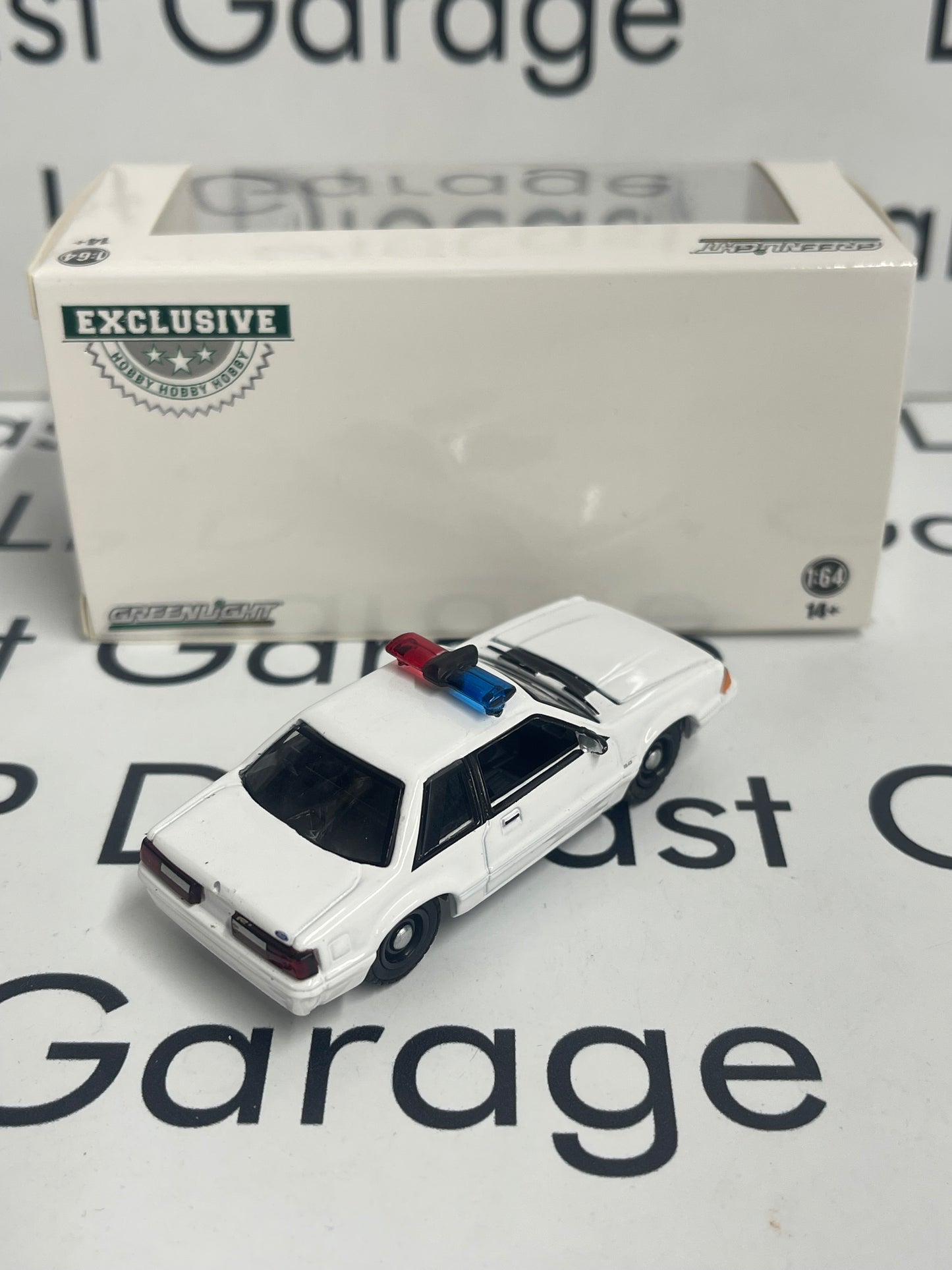GREENLIGHT 1987 Ford Mustang SSP White w/ Police Lightbar 1:64 Diecast Hobby