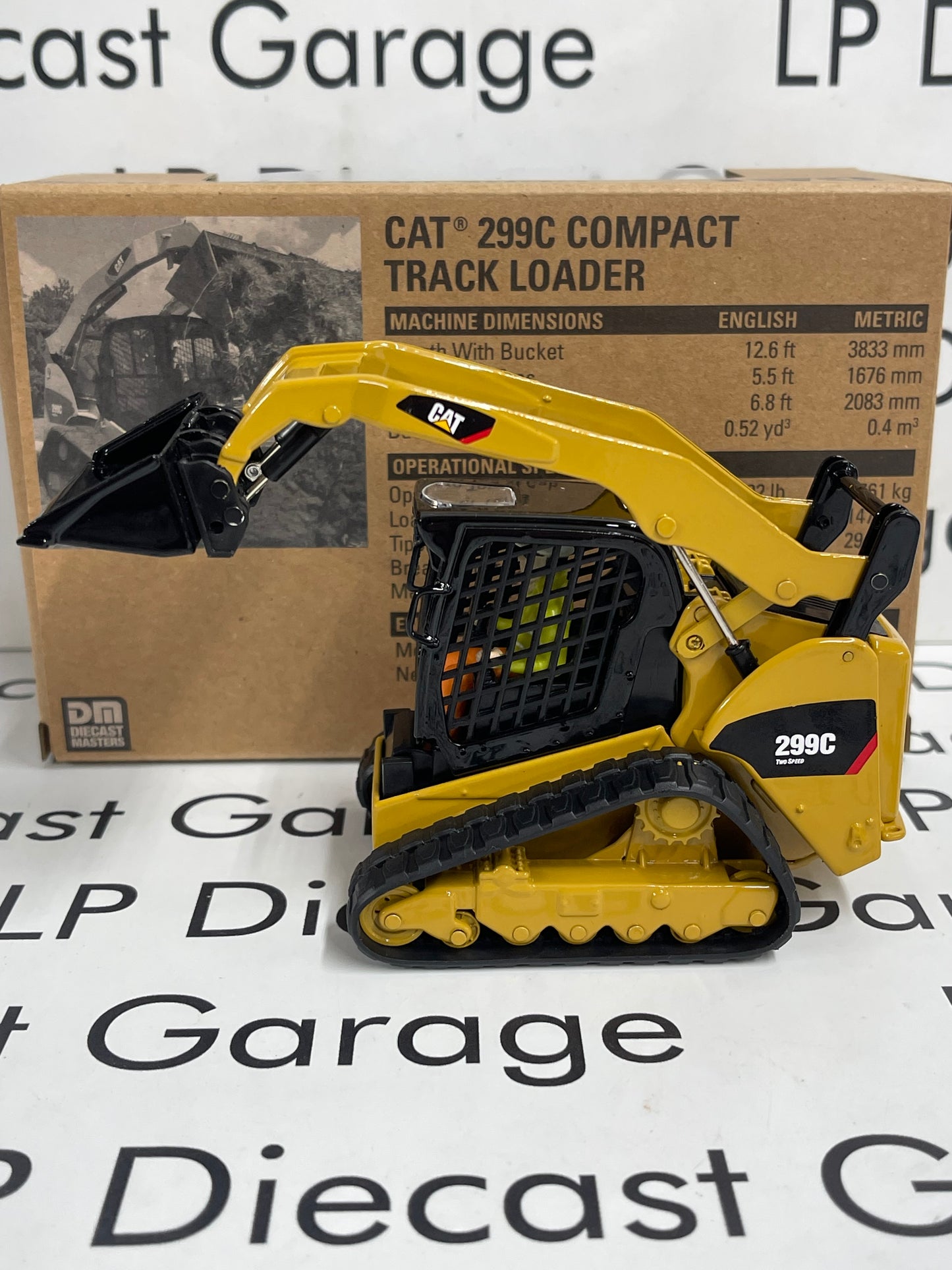 DIECAST MASTERS CAT 299C Compact Track Loader w/ Attachments 1:32 Diecast
