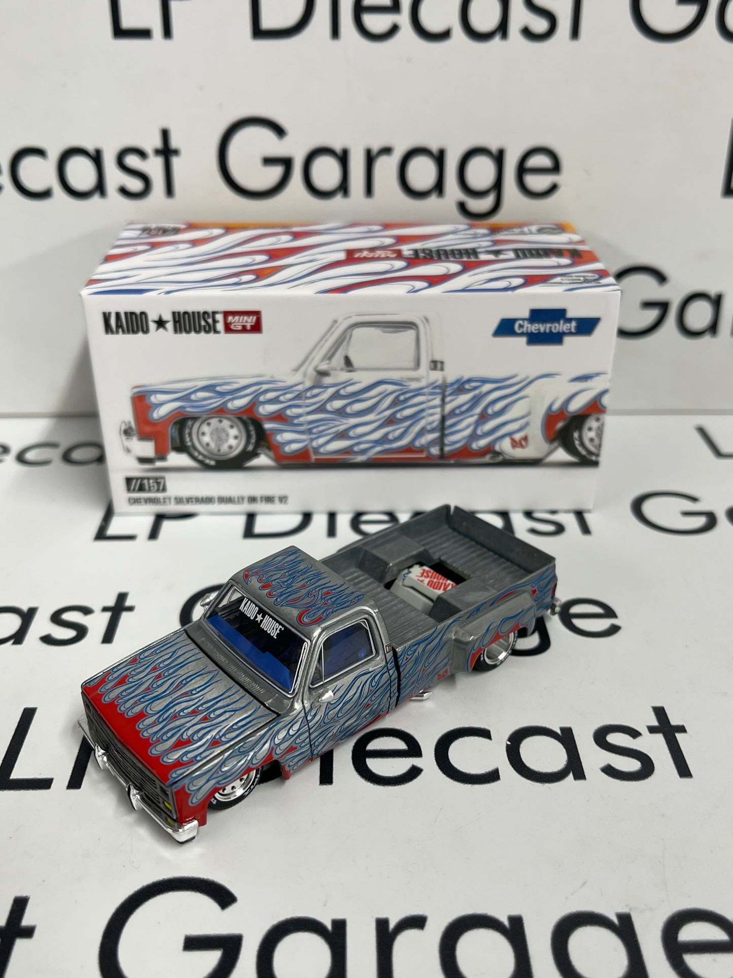 RAW CHASE MINI GT KAIDO HOUSE Chevrolet Silverado Dually on Fire V2 White 1:64 Diecast