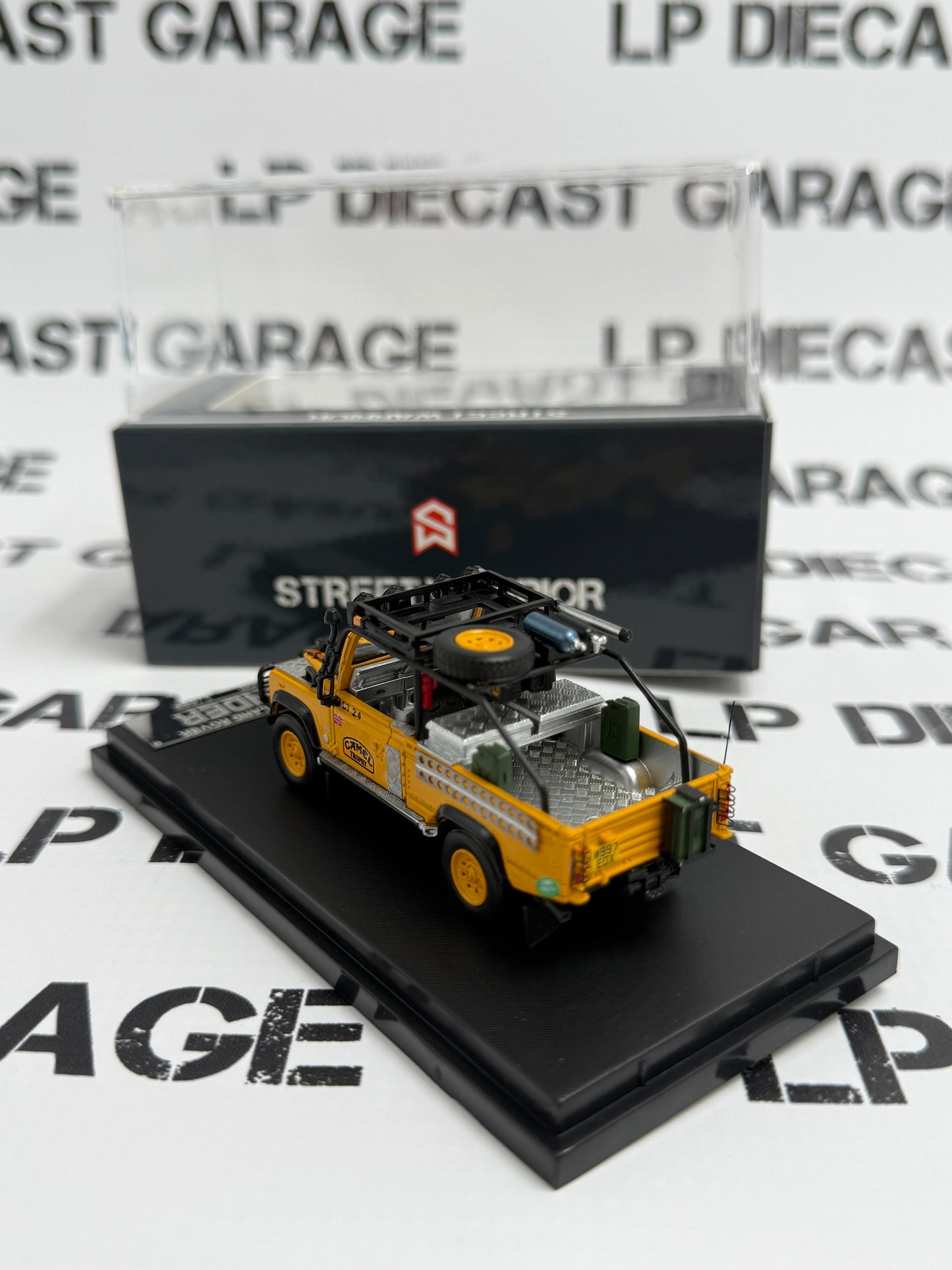 STREET WARRIOR Land Rover Defender Camel Trophy Yellow 1:64 Diecast