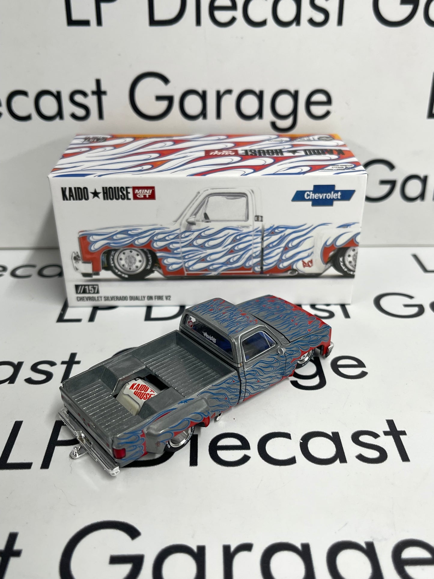 RAW CHASE MINI GT KAIDO HOUSE Chevrolet Silverado Dually on Fire V2 White 1:64 Diecast