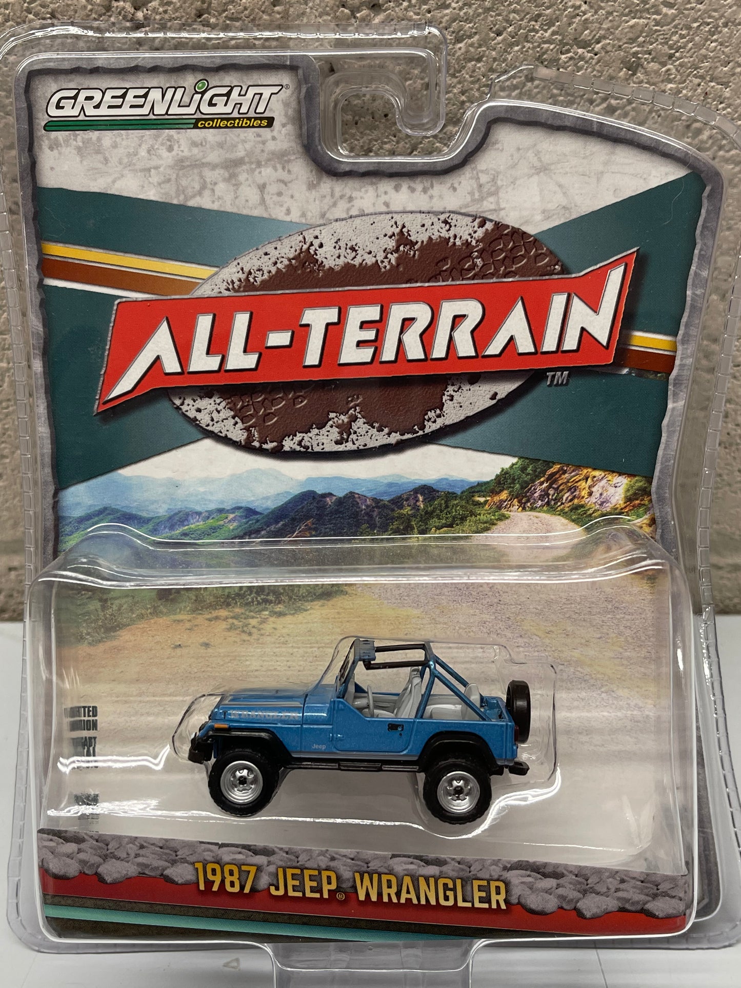 GREENLIGHT 1987 Jeep Wrangler YJ Blue Topless "All Terrain" 1:64 Diecast